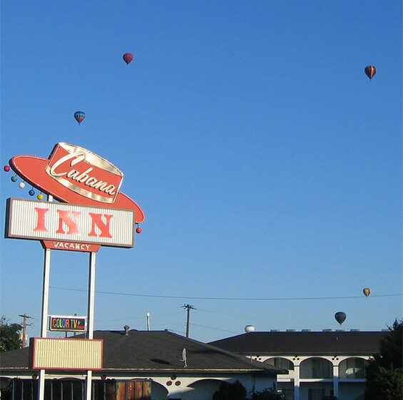 cabana inn sign board with hot air baloons